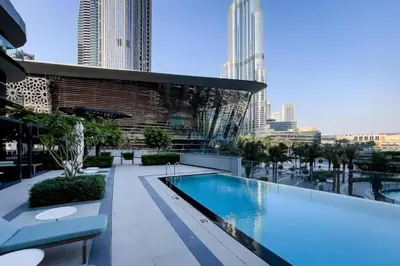 a swimming pool on the roof of a building at Maison Privee - Sky-High Elegance with Unrivaled Burj Khalifa Views in Dubai