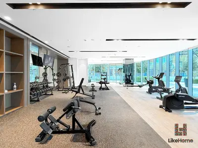 a gym with treadmills and exercise equipment in a building at Enjoy Best Burj Khalifa & Fountain Views From Balcony Luxury 2BR 3 Mins from Dubai Mall - Like Home in Dubai