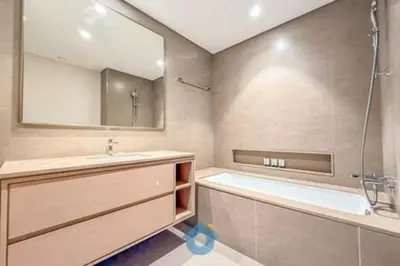 a bathroom with a tub and a sink and a shower at Next to Burj Khalifa & Dubai Mall - Enjoy Dubai Skyline Luxury 2BR Like Home in Dubai