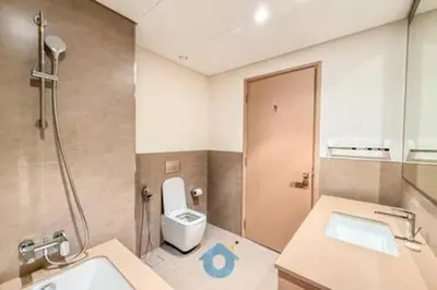 a bathroom with a toilet and a sink and a shower at Next to Burj Khalifa & Dubai Mall - Enjoy Dubai Skyline Luxury 2BR Like Home in Dubai