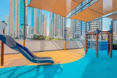 a playground with a slide in a city at Next to Burj Khalifa & Dubai Mall - Enjoy Dubai Skyline Luxury 2BR Like Home in Dubai