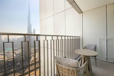 a balcony with a table and a view of a city at Silk Valley - Luxury 2B with iconic Burj Khalifa views and walk to Dubai Mall in Dubai