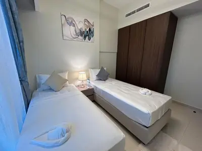 two beds in a hotel room with at Luxurious 2bhk apartment in Business Bay in Dubai