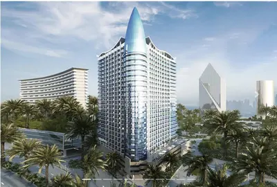 a rendering of a tall building with palm trees at One Click in Dubai