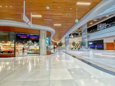 a large shopping mall with a shopping center at Luxury 2BR Stay in DIFC, Steps to Gate Avenue and Dubai Mall in Dubai