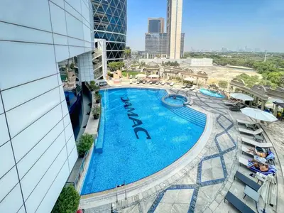 an overhead view of a swimming pool at a hotel at Luxury 2BR Stay in DIFC, Steps to Gate Avenue and Dubai Mall in Dubai