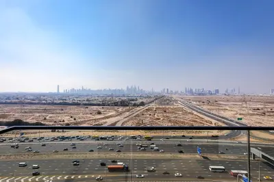 an aerial view of a parking lot with a city at Luxury 1BR at Binghatti Onyx JVC in Dubai