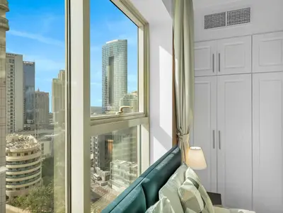 a room with a couch and a large window at Luxurious Home in the heart of Dubai Marina in Dubai