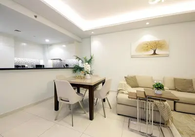 a living room with a table and a couch at The Perfect Stay Paramount Business Bay 2BR in Dubai