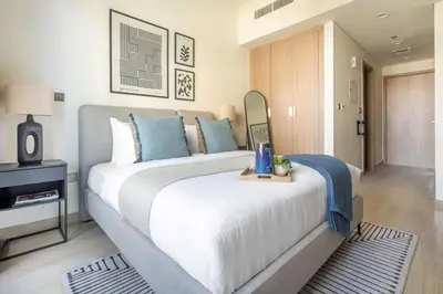 a bedroom with a large bed with a mirror at Frank Porter - Azizi Riviera 26 in Dubai