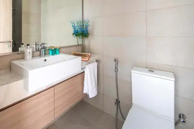 a bathroom with a sink and a toilet at Frank Porter - Azizi Riviera 26 in Dubai