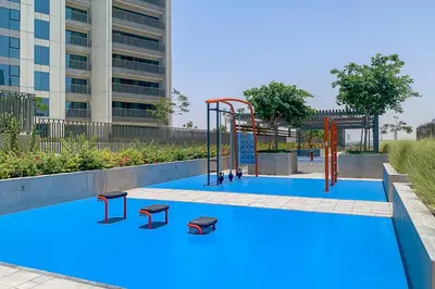 a playground in a pool in front of a building at Frank Porter - Downtown Views II in Dubai