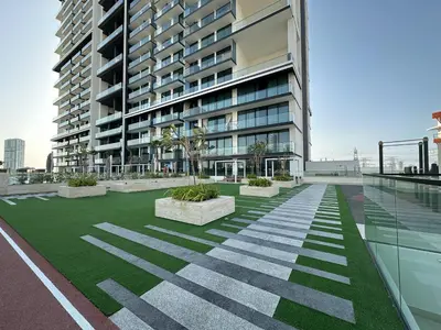 a rendering of a building with a grass courtyard at Trophy-Cultivate Retreat with Statement Design in Dubai