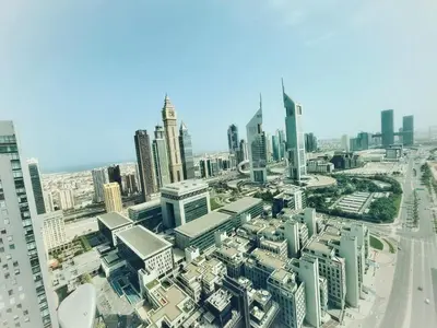 an aerial view of a city with tall buildings at Silkhaus Premium 1BR at Sky Gardens in Heart of DIFC in Dubai
