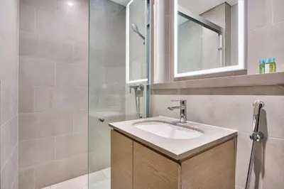 a bathroom with a sink and a shower at STAY BY LATINEM Luxury 1BR Holiday Home W 3516 Near Burj Khalifa in Dubai