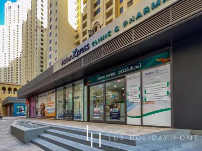 a store front of a building with stairs in front at LUX The Dubai Eye View JBR Studio in Dubai