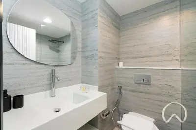a bathroom with a white sink and a mirror at Upgraded 2BR In La Riviera Marina - Close to Beach in Dubai