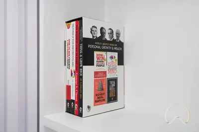 a group of four books sitting on a shelf at Upgraded 2BR In La Riviera Marina - Close to Beach in Dubai