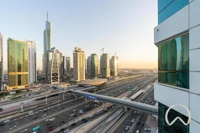 a busy freeway in a city with buildings at Upgraded 2BR In La Riviera Marina - Close to Beach in Dubai