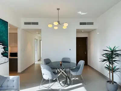 a dining room with a table and chairs at Your Home away from Home in Dubai