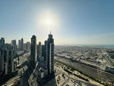 an aerial view of a city with tall buildings at Your Home away from Home in Dubai