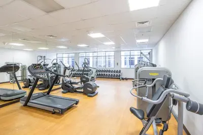 a gym with several treadmills and cardio machines at Stunning Views Spacious 3BR Dubai Marina in Dubai