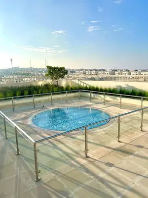 a swimming pool on the roof of a building at Vibrant studio - 15m to marina in Dubai