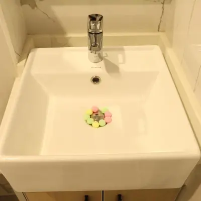 a white sink with a toy in the middle at 1BHK Homes For Holidays in Dubai