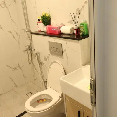 a bathroom with a toilet and a sink at Luxurious Studio Apartment in Dubai