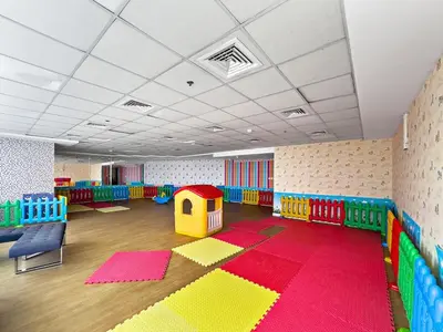 a brightly colored room with a play room with a rug at Stylish Dubai Downtown Studio by Burj Khalifa in Dubai
