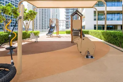 a monkey on a playground in a city at Sea-facing 1BR at Beachfront 50 Off Eid Promo in Dubai