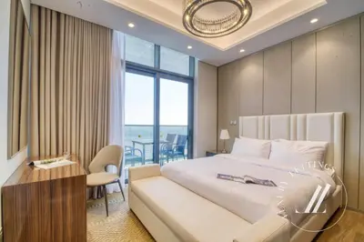 a bedroom with a bed and a desk and a window at 3BDR Business Bay Bliss High Floor Private Balcony in Dubai