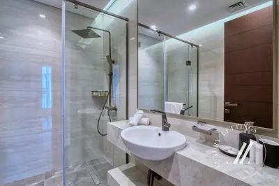 a bathroom with a sink and a shower at 3BDR Business Bay Bliss High Floor Private Balcony in Dubai