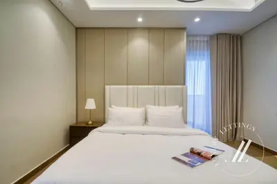 a bedroom with a large white bed and a window at 3BDR Business Bay Bliss High Floor Private Balcony in Dubai