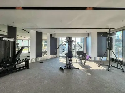 a room with a gym with a treadmill and a exercise bike at 3BDR Business Bay Bliss High Floor Private Balcony in Dubai