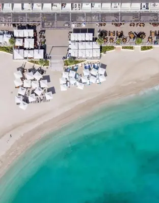 an aerial view of a beach with white buildings and the water at Bright Beachfront Studio with Breathtaking Views in Dubai