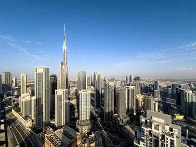 an aerial view of a city with tall buildings at Sky Suite 1 Bedroom Apartment with Infinity Rooftop Pool and Dubais Ultimate Skyline View at Paramount Midtown in Dubai