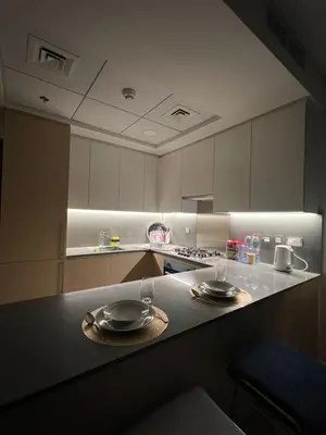a kitchen with two empty plates on a counter at Cozy Home with Beach Access in Palm Jumeirah in Dubai