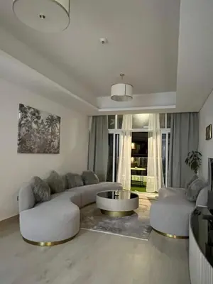 a living room with a couch and a coffee table at Cozy Home with Beach Access in Palm Jumeirah in Dubai