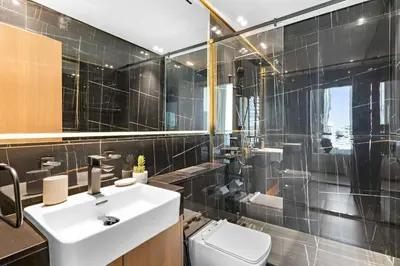 a bathroom with a sink and a toilet at Silkhaus Classic 1BDR Apartment in Binghatti House in Dubai