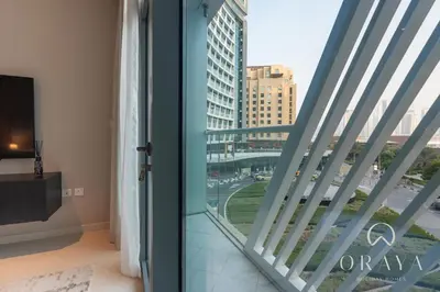 a room with a window with a view of a city at Luxurious Studio In Seven Palm - Direct Beach Access in Dubai