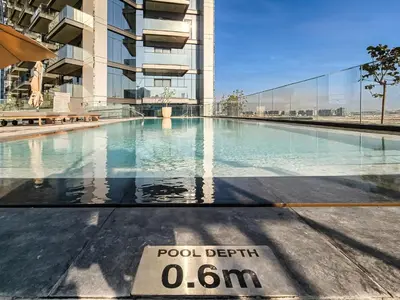a swimming pool on the roof of a building at Spacious & Elegant 1BD, for 2 in Nobles tower in Dubai
