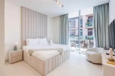 a bedroom with a bed and a large window at Charming 1 Bedroom Apt in MBR - Near Downtown Dubai in Dubai