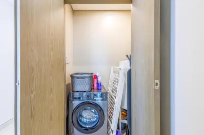 a washer and dryer in a small room at Charming 1 Bedroom Apt in MBR - Near Downtown Dubai in Dubai