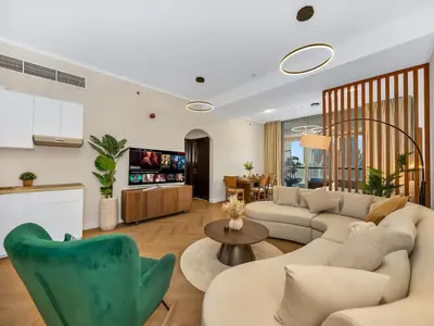 a living room with a couch and a table at Luxury 4BR - Full Marina View - High Floor Bliss in Dubai