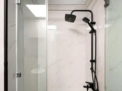 a shower with a glass door in a bathroom at Luxury 4BR - Full Marina View - High Floor Bliss in Dubai