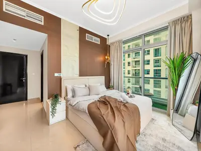 a bedroom with a large bed and a large window at Luxury 4BR - Full Marina View - High Floor Bliss in Dubai