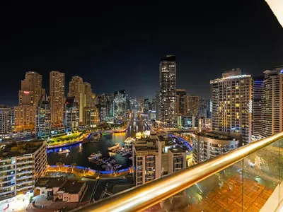 a view of a city skyline at night at Luxury 4BR - Full Marina View - High Floor Bliss in Dubai