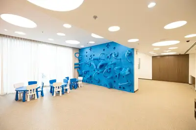 a conference room with chairs and a blue wall at FORTE Tower 2 - One-Bedroom Apartment in DOWNTOWN Dubai, near Burj Khalifa & Dubai Fountains - Apartment in Forte Tower 2 in Dubai