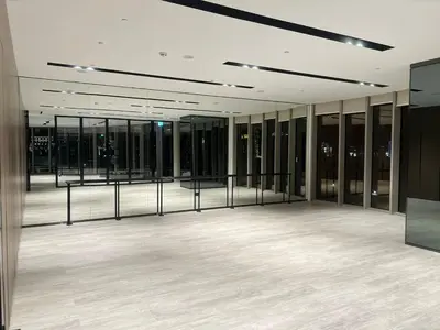 a large empty room with glass partitions in a building at NEW YEARS Luxury Burj Khalifa and Fountain Views in Dubai